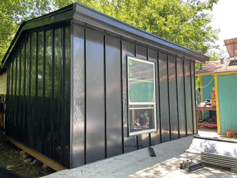 Black standing seam metal wall panels for Roof Inspection in Des Moines